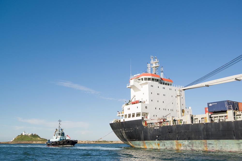 A ship with tug in Australia